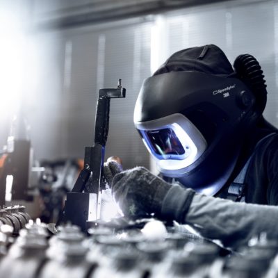 Employees of the foundry GTR assemble cast parts for vehicle construction with punched parts