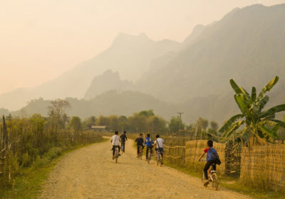 children riding bikes on street in vietnam social projects gtr vietnam
